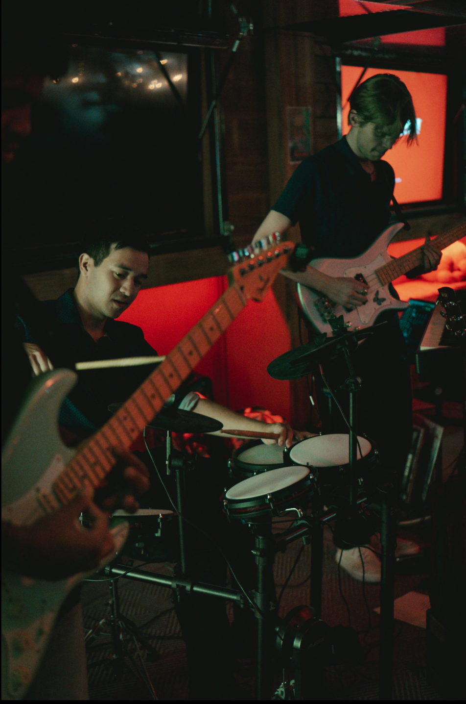 Bassist and drummer sharing a moment