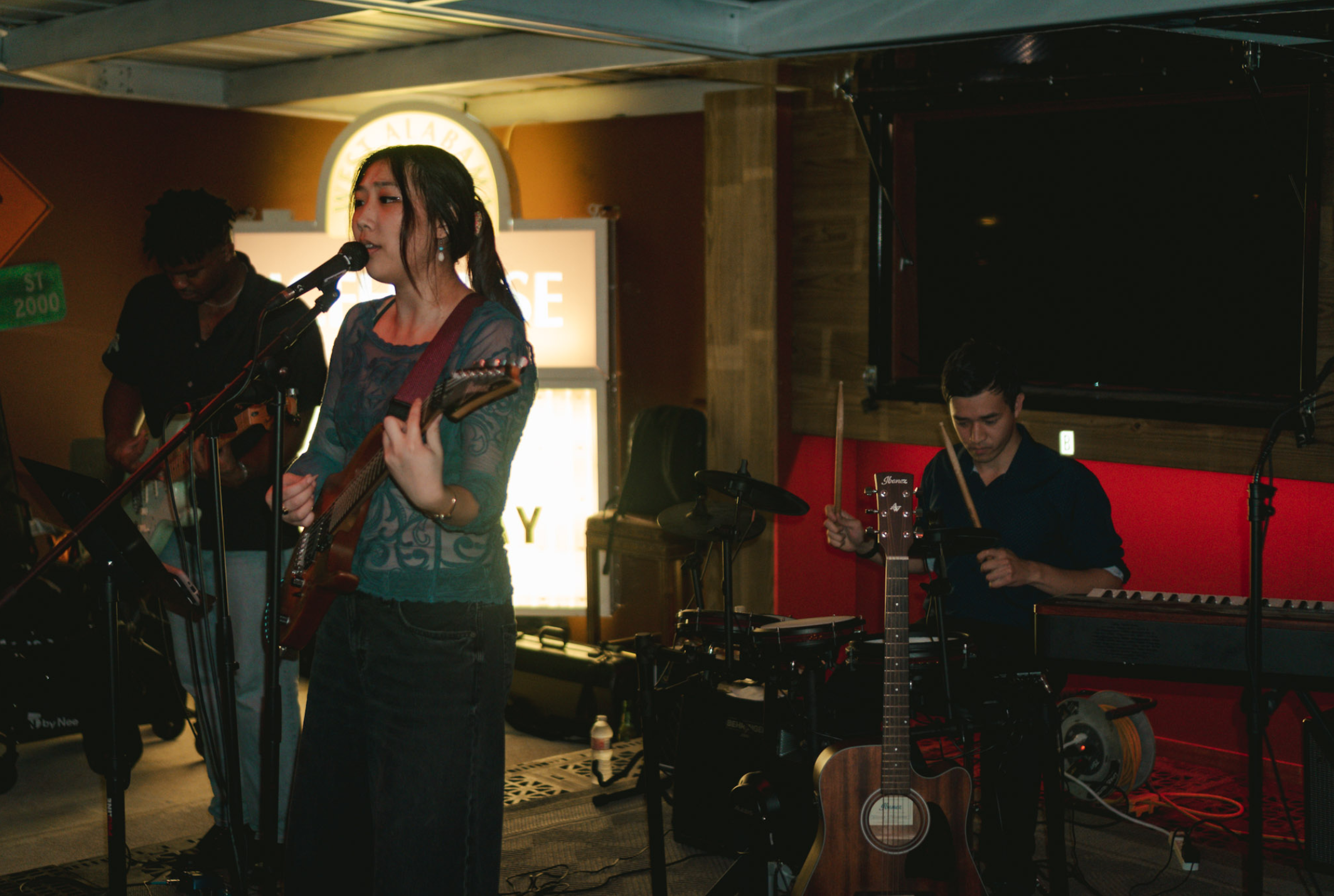 Vocalist performing with ornate backdrop