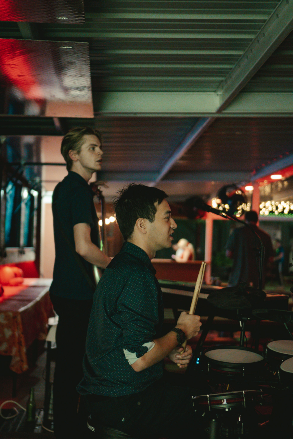 Audience visible with band performing